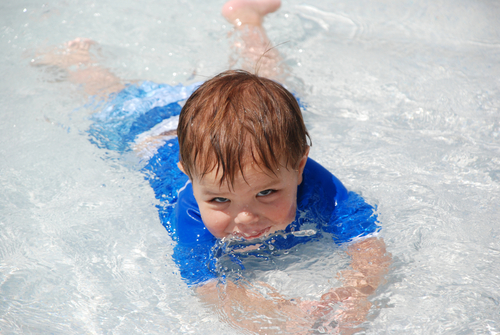 child in shallow pool