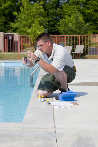 man checking chlorine