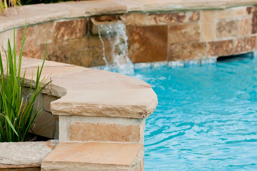 pool with natural stone walls