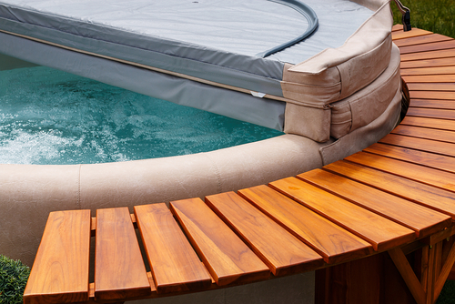 wood and leather circular hot tub with cover